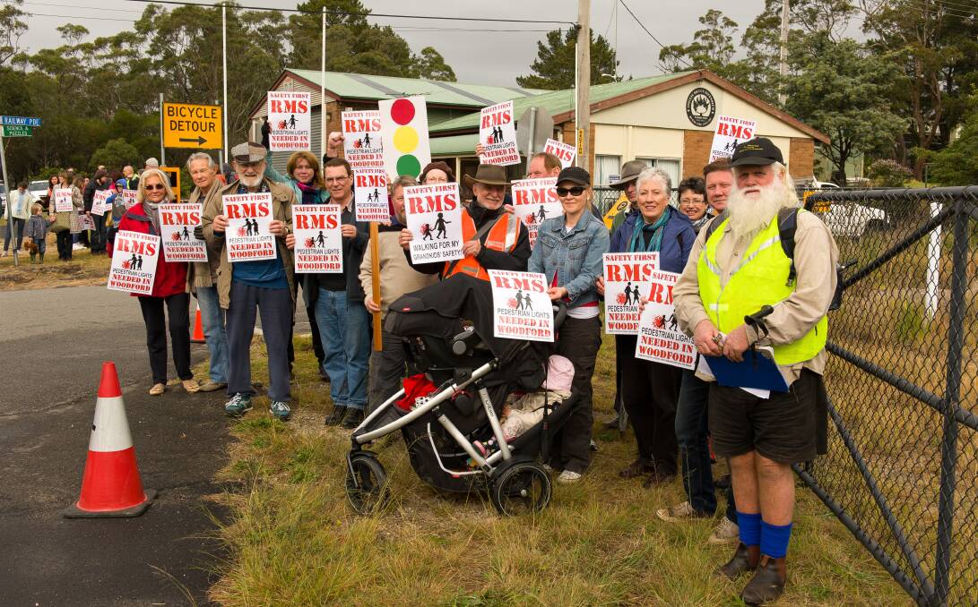 Foot soldiers: Woodford residents protesting at the Park Road bridge in June 2013. It took more than two years of discussions, lobbying and protesting to get the RMS to agree to a footpath. Photo: Jodi McConaghy