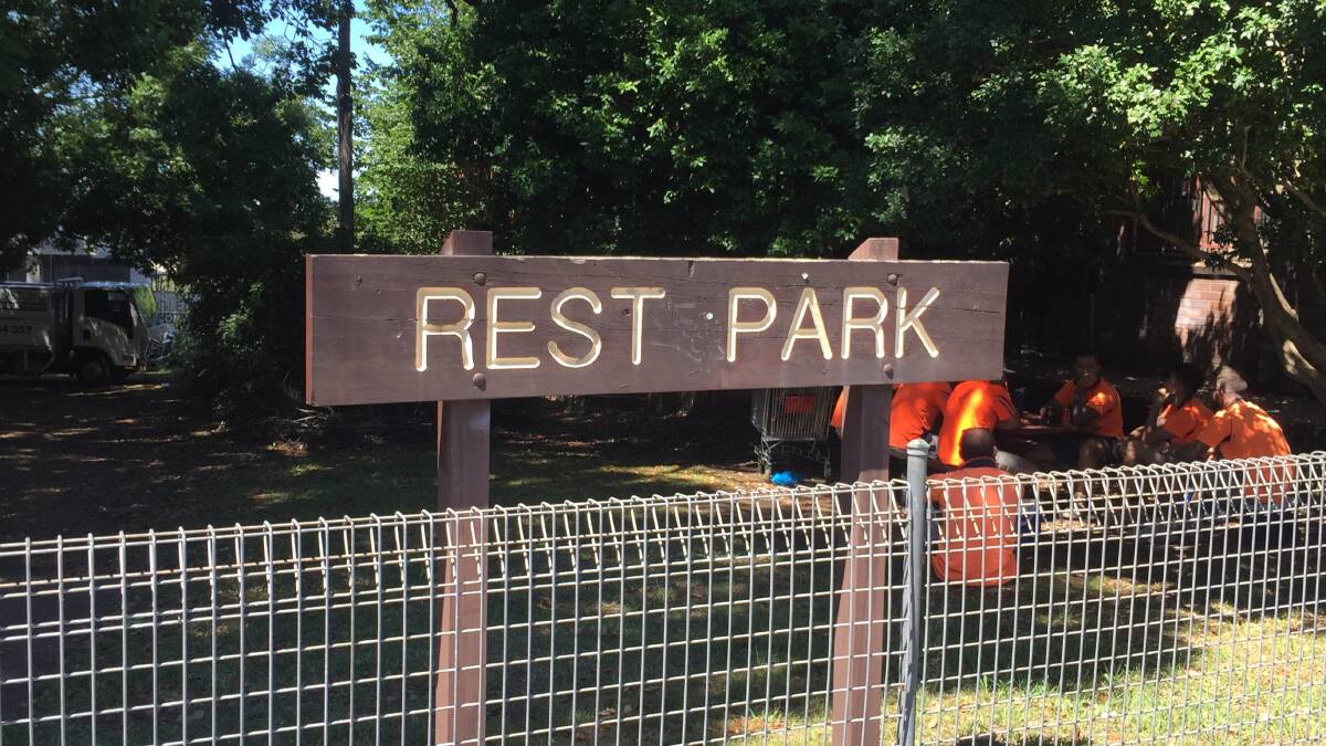 Unloved, unwanted: Workmen from the neighbouring new unit development are some of the few users of Rest Park in Springwood.