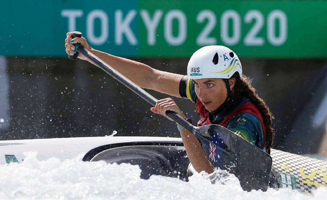 Determined: Fox negotiates the course in the women's C1 canoe slalom. Photo: AP