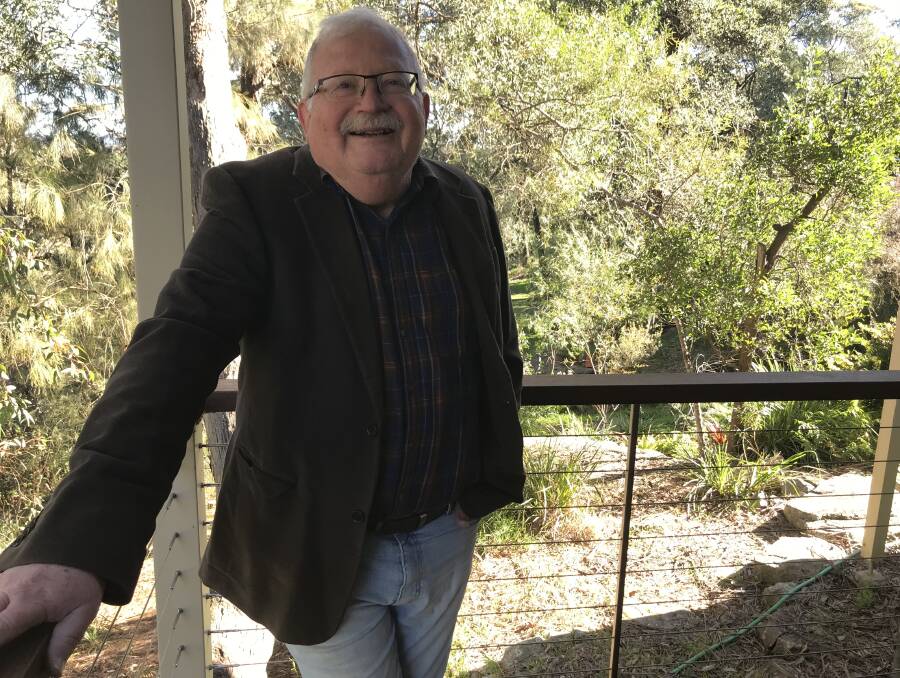 Donald Mason OAM: The architect on the deck of the Blaxland house which he designed. 