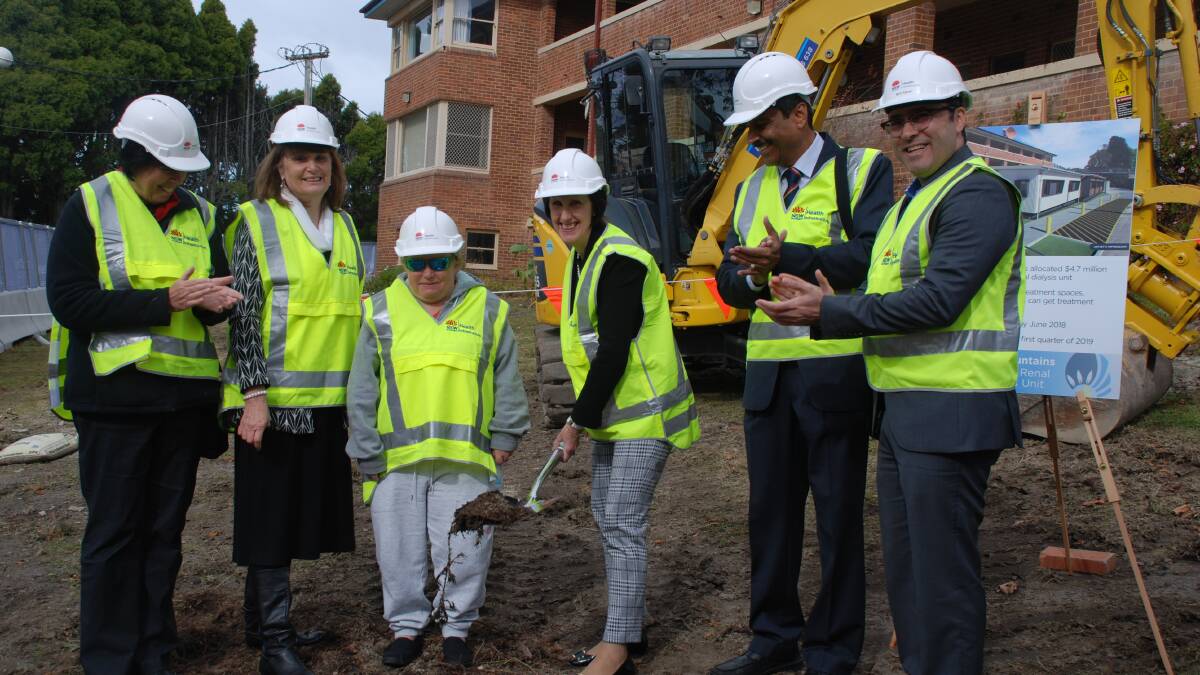 Leslie Williams, parliamentary secretary for regional and rural health, wields the shovel watched on by Kim Scanlon, director of planning, NBMLHD, Andrea Williams, Katoomba Hospital general manager, dialysis patient Melissa Hodges, Dr Kamal Sud, department head of the renal unit at Nepean Hospital, and Mohammad Ashari, project director for health infrastructre.