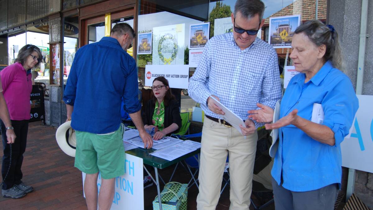 Blackheath Highway Action Group: Michael Paag discusses the options with local resident, Eva Johnstone, in Blackheath village on Saturday morning. 