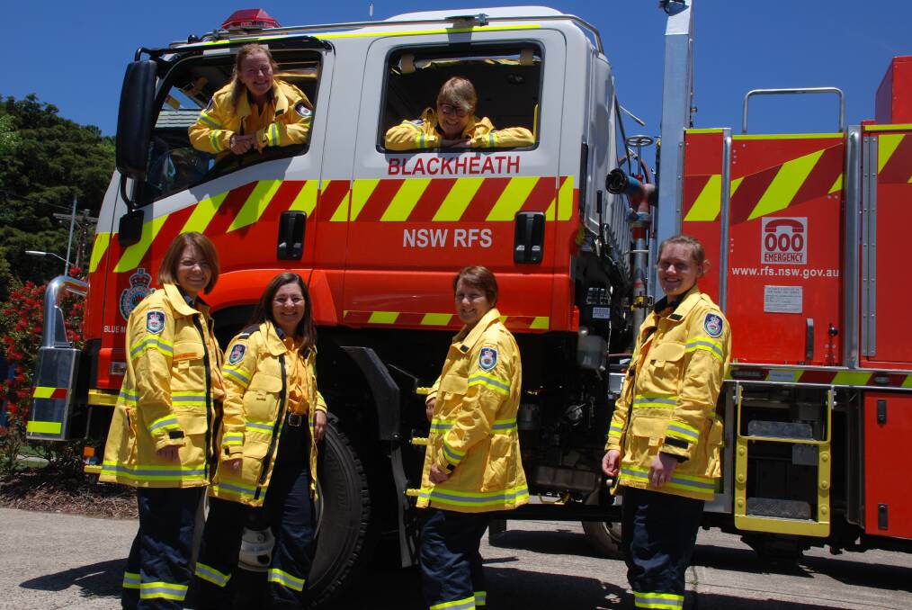 Made to fit: Volunteers with the Blackheath-Mt Victoria RFS. Standing from left, president Sharyn McIntosh, deputy captain Catrina Jordan, Mina Howard and Eddy Ruse. In windows, Kathy Wilson and Anna Gertsen.