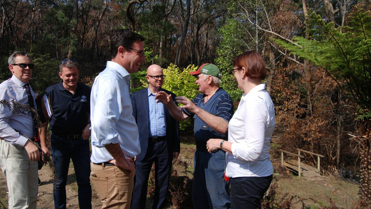 Michael Paag from the Blackheath Alliance, head of the National Bushfire Recovery Agency Andrew Colvin, the Minister for Natural Disaster and Emergency Management David Littleproud, Blue Mountains mayor Mark Greenhill, Rhododendron Gardens expert Dick Harris and Macquarie MP Susan Templeman at the Campbell Rhododendron Gardens earlier this evening (Monday).