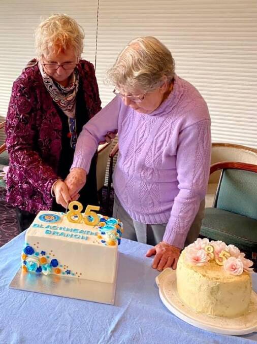 Long-time members Lynette Bice (left) and Jean Twyford had the honour of cutting the branch's birthday cake.