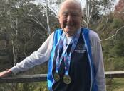 Champion: Ninety-year-old Roy Bennett with his gold medals for javelin and discus.