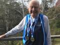 Champion: Ninety-year-old Roy Bennett with his gold medals for javelin and discus.
