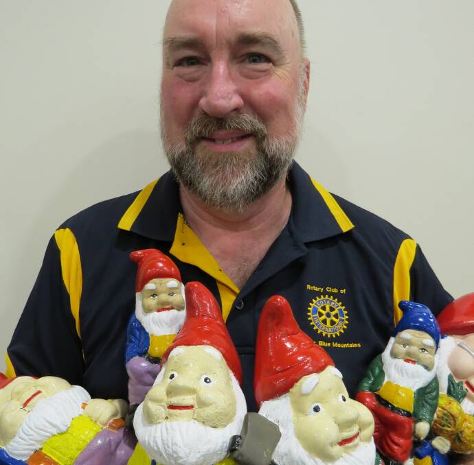 Looking smart: Gnome painter Dave Clark with some of his freshly painted friends.