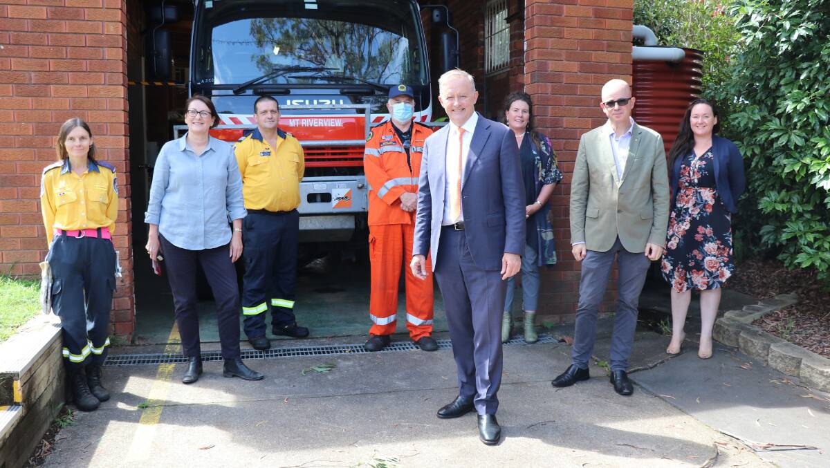 Holding a hose: Mt Riverview RFS brigade member Tracey Haslam, Federal Member for Macquarie Susan Templeman, Mt Riverview RFS Brigade Captain Andrew Fleming, Blue Mountains SES Deputy Controller Michael Biber, Opposition Leader Anthony Albanese, Blue Mountains MP Trish Doyle, Blue Mountains Mayor Mark Greenhill, Ward Four councillor Nyree Fisher.