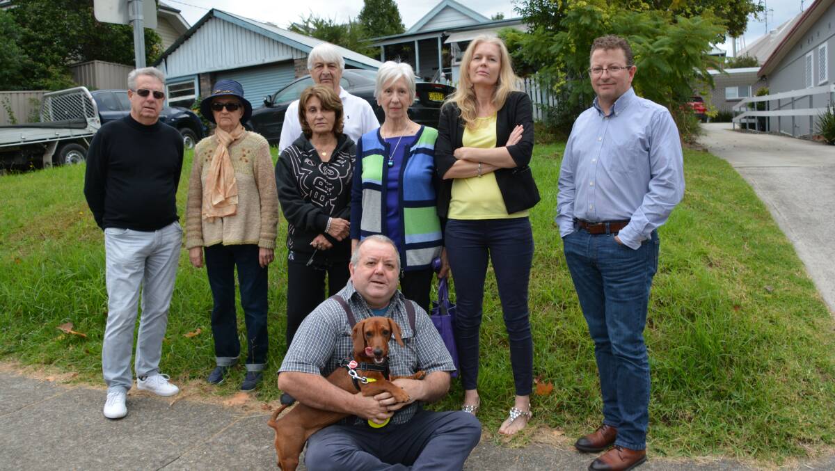 Vindicated: Some of the Springwood Says No group who objected to plans to build a four-storey boarding house on the site of this house. Anthony Gunther, on the right, said he welcomed the planning panel's rejection of the DA. 
