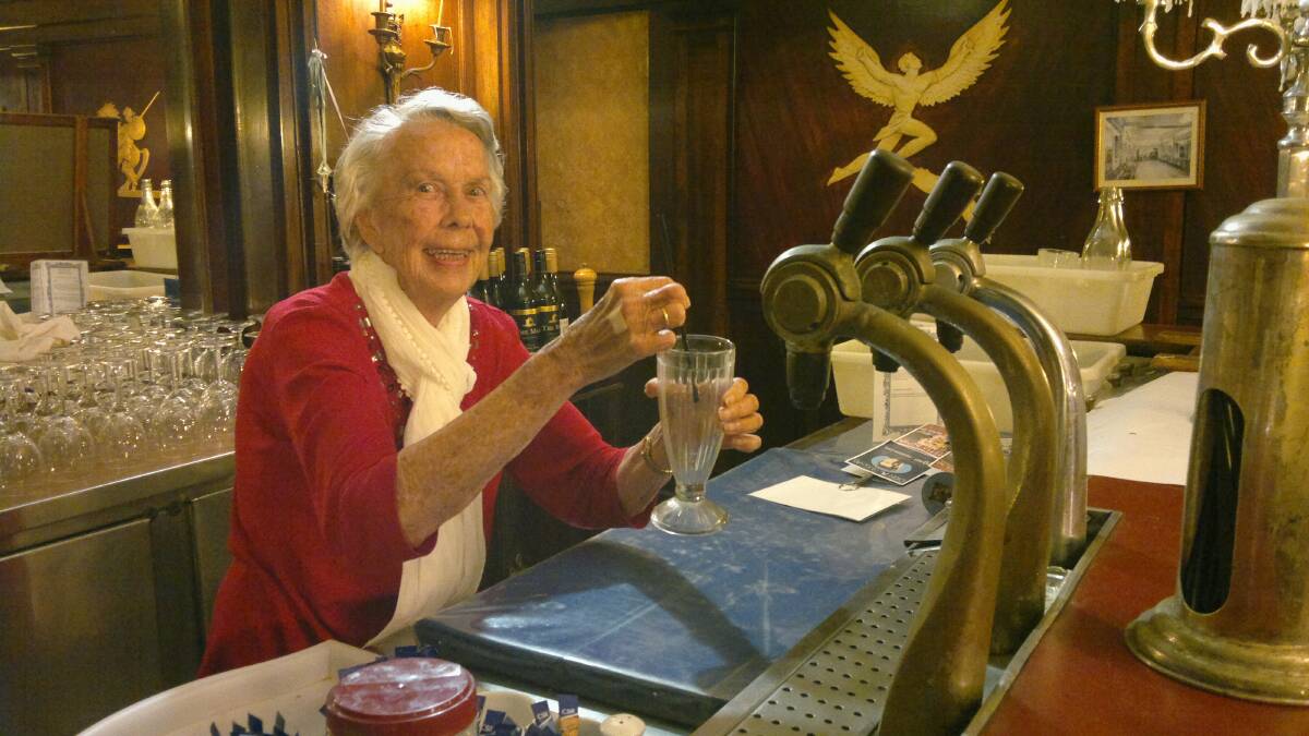 Winding back time: Joyce Thomson behind the soda fountain at the Paragon Cafe in Katoomba, some 70 years after she worked there as a teenager.