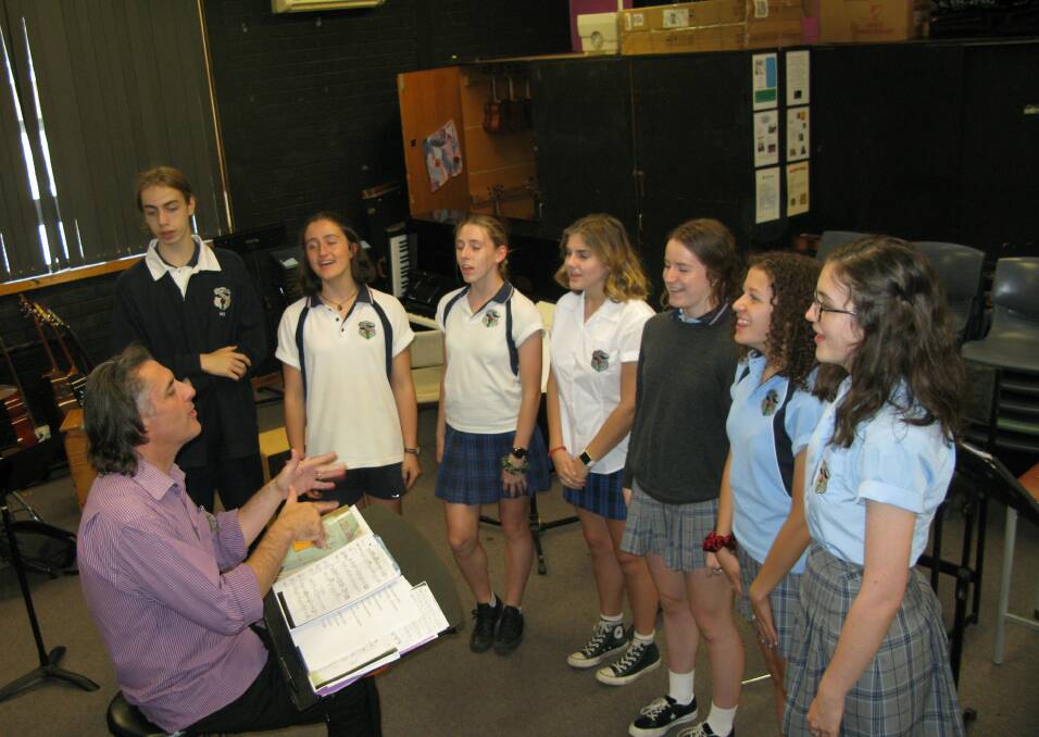 Young Jets and Sharks: David Leishman rehearses West Side Story with Blaxland High Singers.