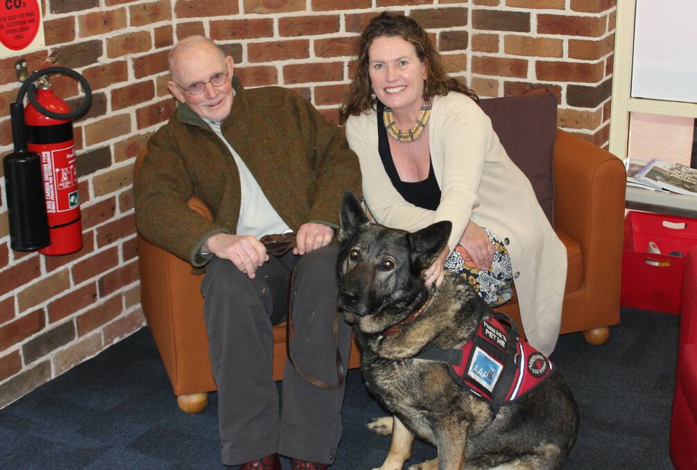 Doggone it: Blue Mountains MP, Trish Doyle, with Dr William Silk and Sophie the assistance dog, who have had a long wait for a travel pass