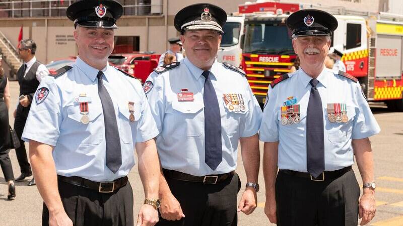 David and John Dufty with (centre) FRNSW Commissioner Paul Baxter at the medal ceremony.