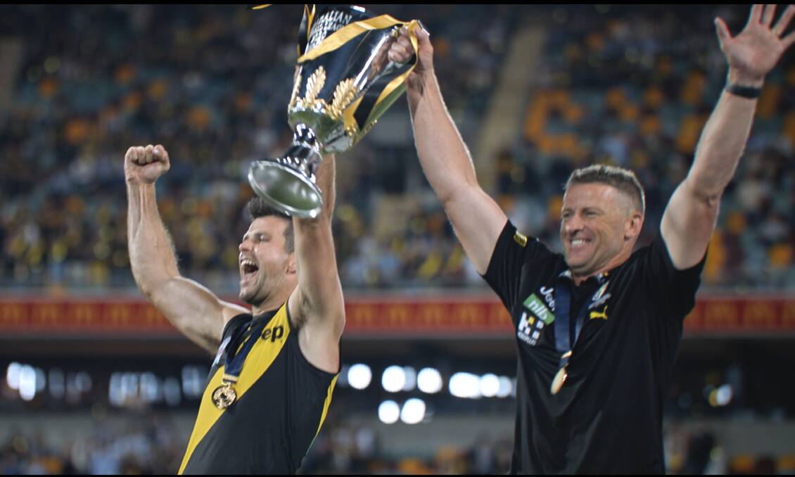 PREMIERS: Richmond captain Trent Cotchin and coach Damien Hardwick celebrate the Tigers' AFL grand final victory.