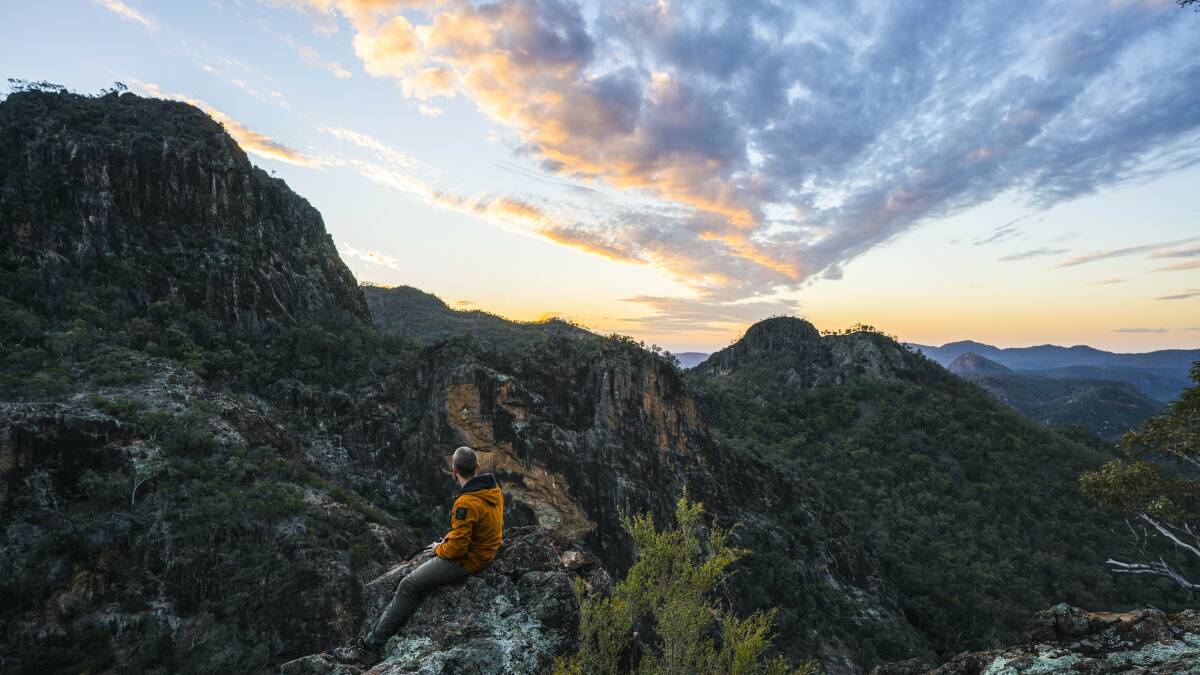 Catch sunset from on high on a trek through the Warrumbungle National Park. Picture: Destination NSW