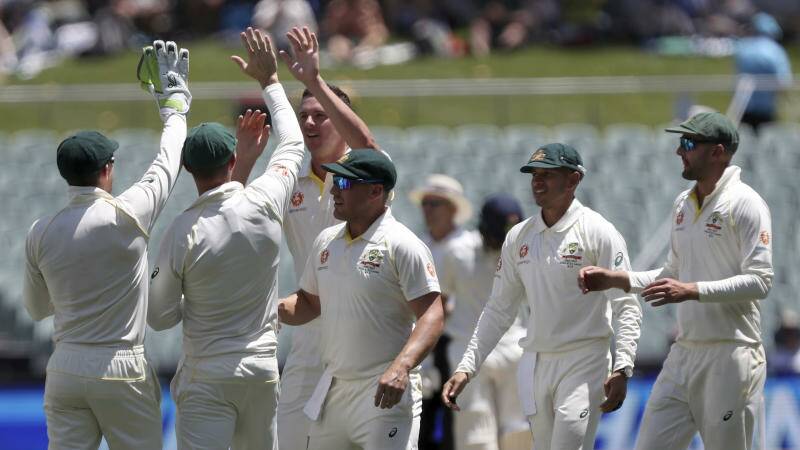 Australia's Josh Hazlewood, third left, is congratulated by teammates after dismissing India's Ajinkya Rahane. Photo: AP