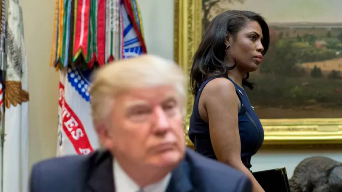 Omarosa Manigault Newman, formerly the director of communications for the Office of Public Liaison, walks past President Donald Trump during a March, 2017 meeting.

Photo: AP