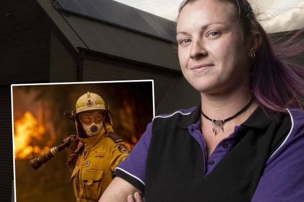 Milton Rural Fire Brigade volunteer Stacey Wilson with Sitthixay Ditthavong's amazing image from the fireground on December 5.