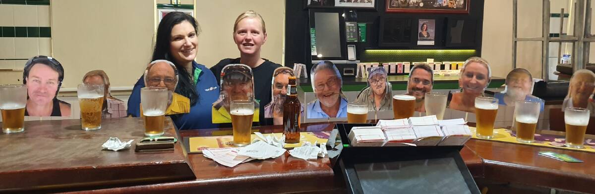 PUB HUMOUR: Jess Bartlett and Angela Graham found a way to stay connected to their regular customers.