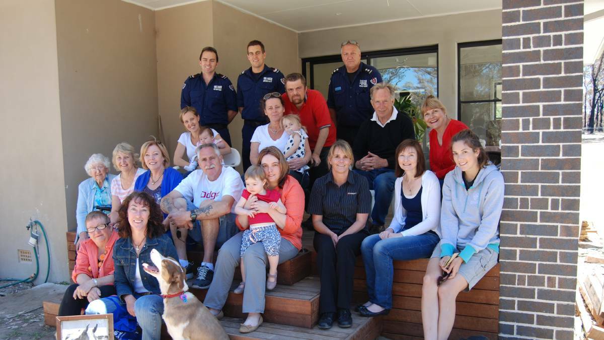 October 2013: Officers Andrew Sarson, Phil Holdsworth and Tony Gutteridge, with Bob and Susan Pearson (back right) and some of those who took shelter.
