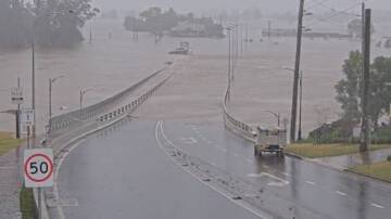 Windsor Bridge under water on Monday morning. This picture was taken by the Life Traffic NSW camera at George Street looking north towards Windsor Bridge. Picture: Live Traffic NSW