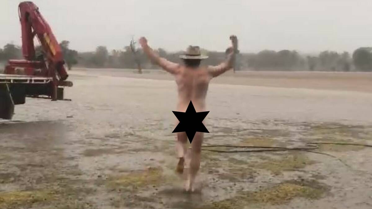 CELEBRATION: Dubbo farmer Glen Bloink stripped off for a 'nudie run' to celebrate rain fall across his drought-stricken property on the weekend. Photo: MIN COLEMAN