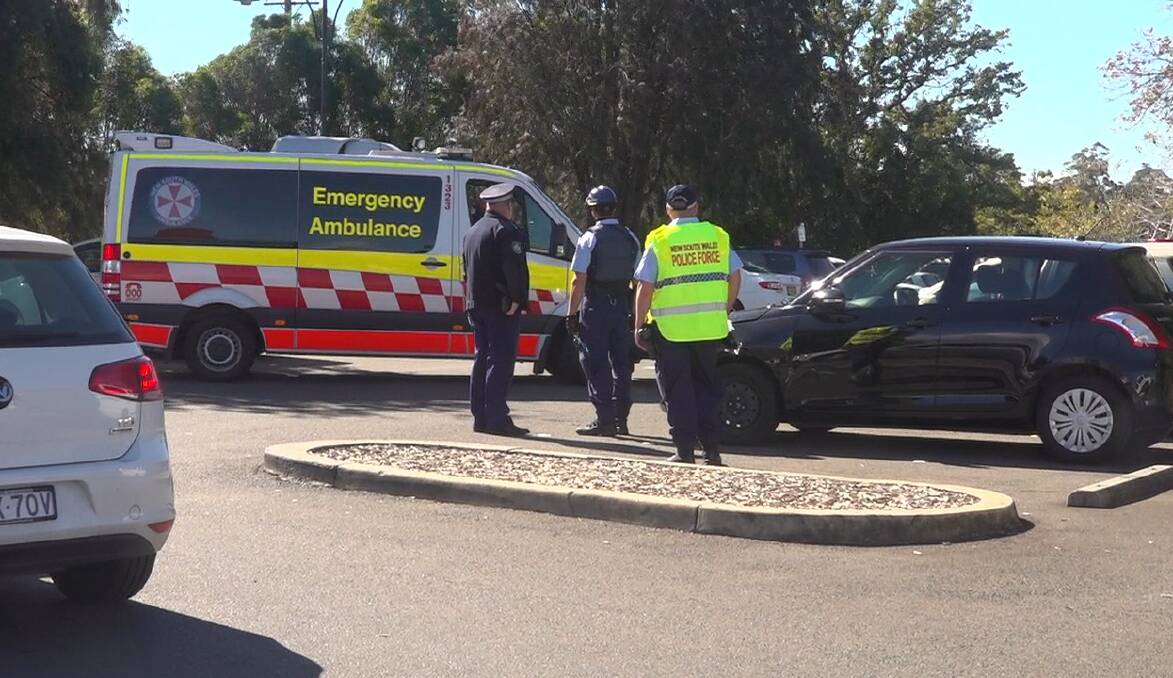 On scene: A pedestrian sustained minor injuries after becoming trapped between two cars in a carpark in Springwood last week. Photo: Top Notch Video