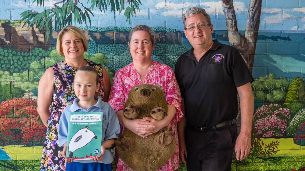 Book launch: Relieving principal Kim Curran, teacher Deborah Greenhill, Warren Hole, of Springwood Printing, who was instrumental in the book's production, and Jasmine Mountain, whose picture features on the book cover.