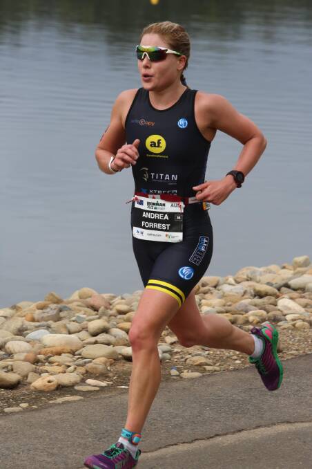 On the run: Andrea Forrest chases down the competition in the Western Sydney 70.3 in November.