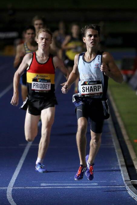 Doing battle: New Zealander Isaiah Priddey and Jackson Sharp duel at the Australian Junior Athletics Championships.