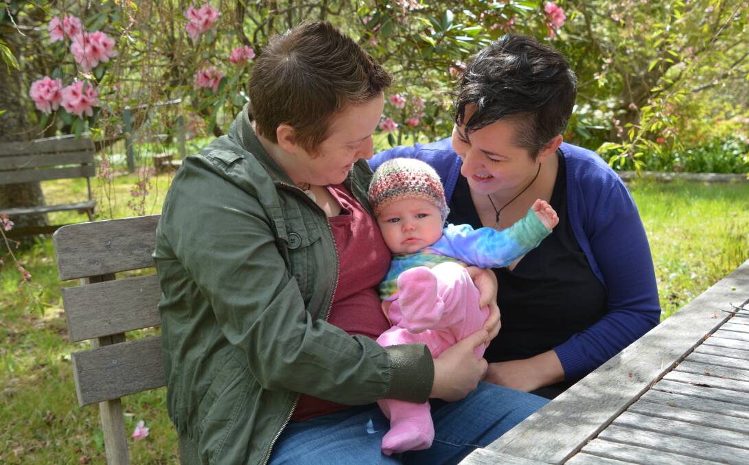 Loving family: Amanda Solomons and Simone Bateman with their daughter Stella. They would love to marry, but would prefer to wait for a free parliamentary vote, than go through a divisive plebiscite campaign.