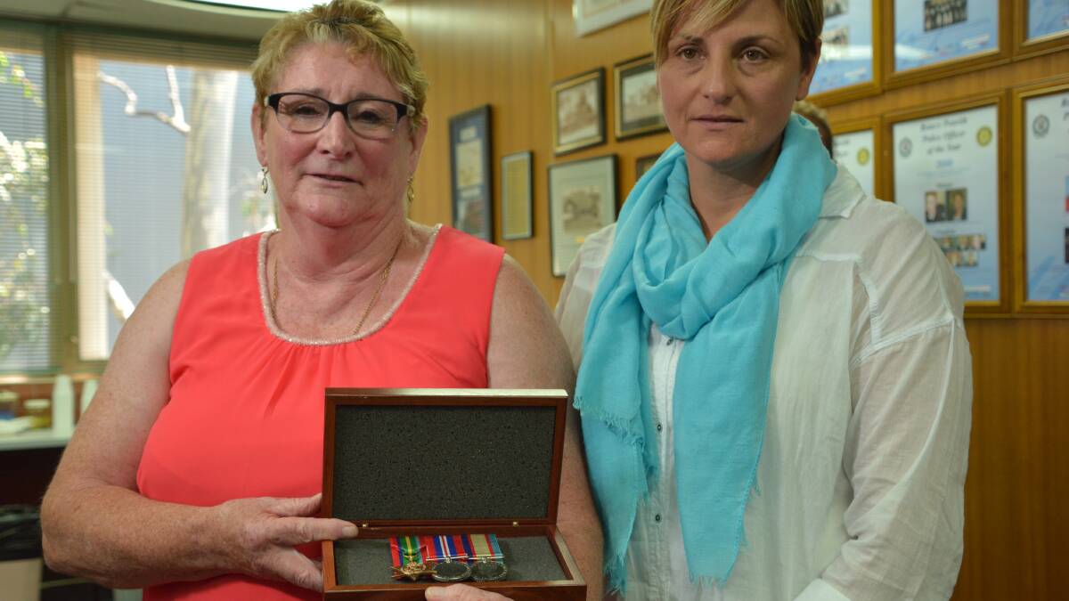 It's a miracle: Sue Summers and daughter Ann Smith with the war medals they had given up hope of ever seeing again.