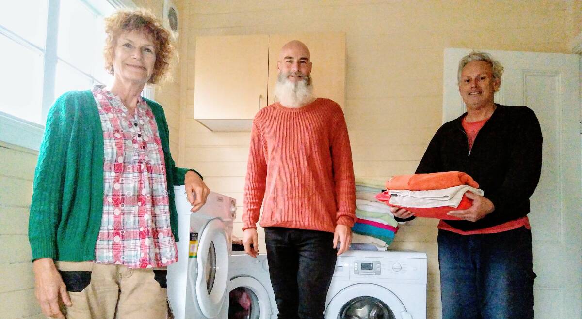 Council lifeline: Councillor Kerry Brown with Earth Recovery Australia's director Justin Morrissey and facilities co-ordinator Stephen Bradley at the currently closed laundry, shower and toilet facilities for homeless people at Junction 142 at Katoomba Uniting Church.