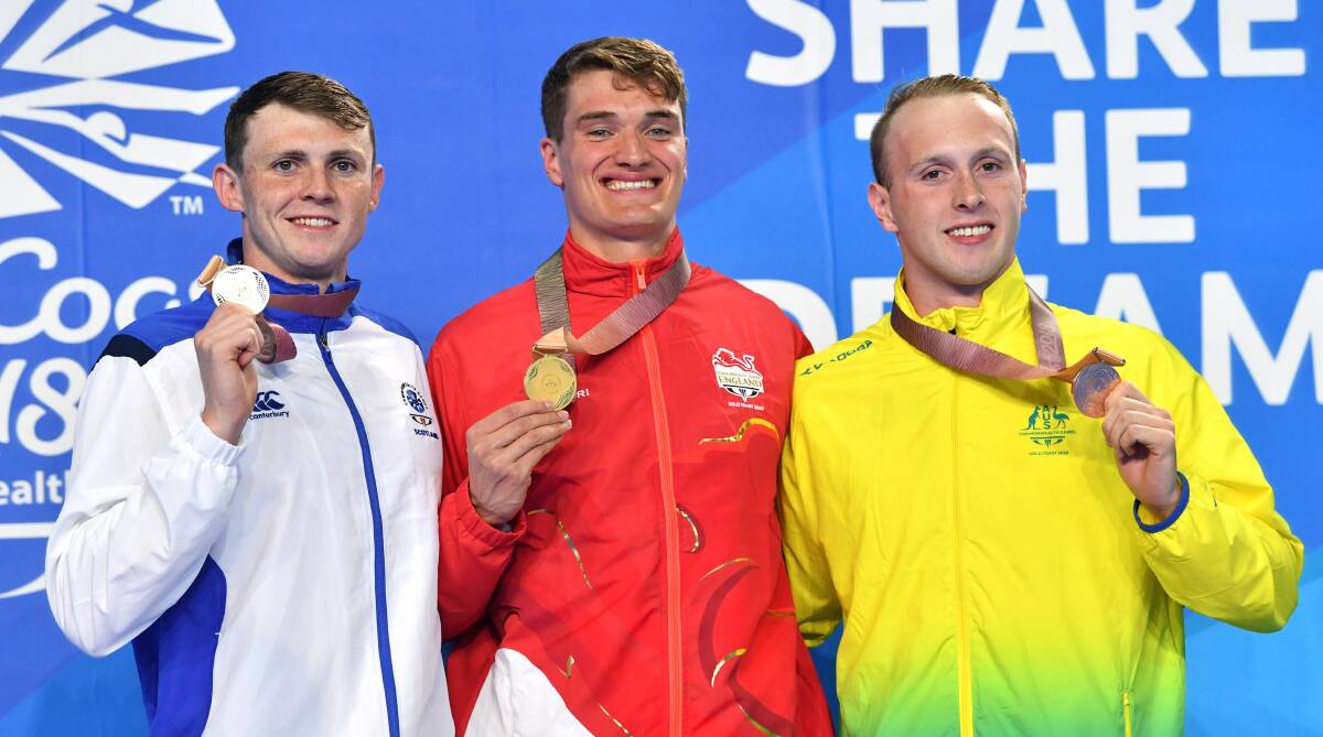 First Commonwealth Games medal: Bronze medalist Matt Wilson (right) with gold medalist James Wilby (centre) of England with silver medalist Ross Murdoch (left) of Scotland. Photo: AAP Image/Darren England.