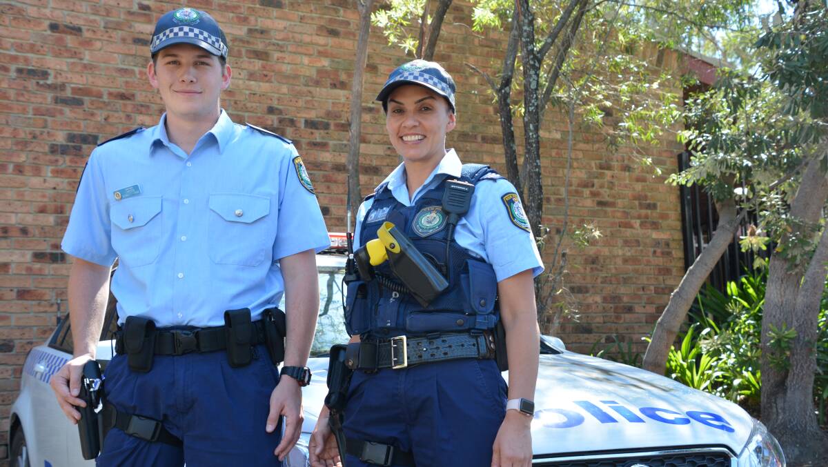 First day on the job: Probationary Constable Lawson Kennett-Tribe with his supervisor, Sergeant Tracy Brickwood. The young officer started at Springwood police station on December 11.
