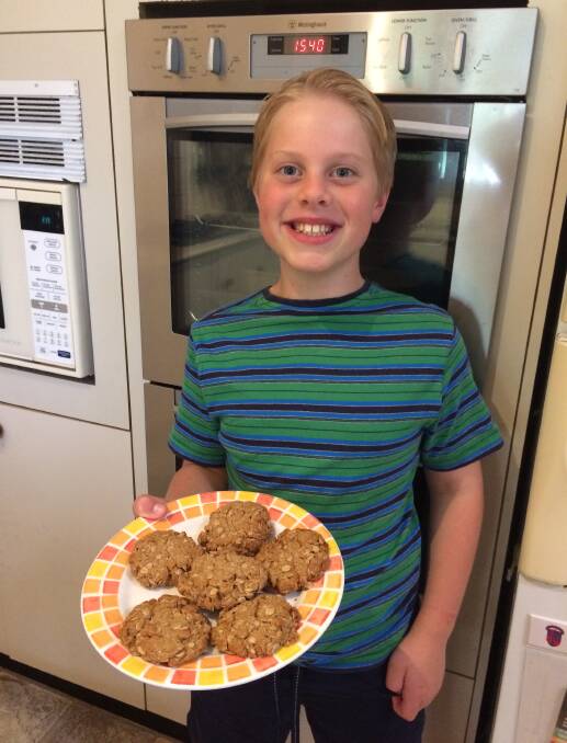 Tasty treat: Nine-year-old Elliot Spolc with his award-winning Anzac biscuits. 