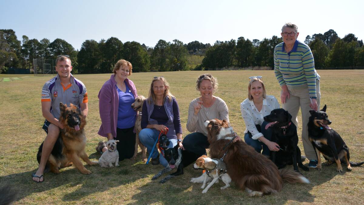 File photo of dog owners at Pitt Park in Wentworth Falls. They do not want to see the off-leash area moved to Murray Park.