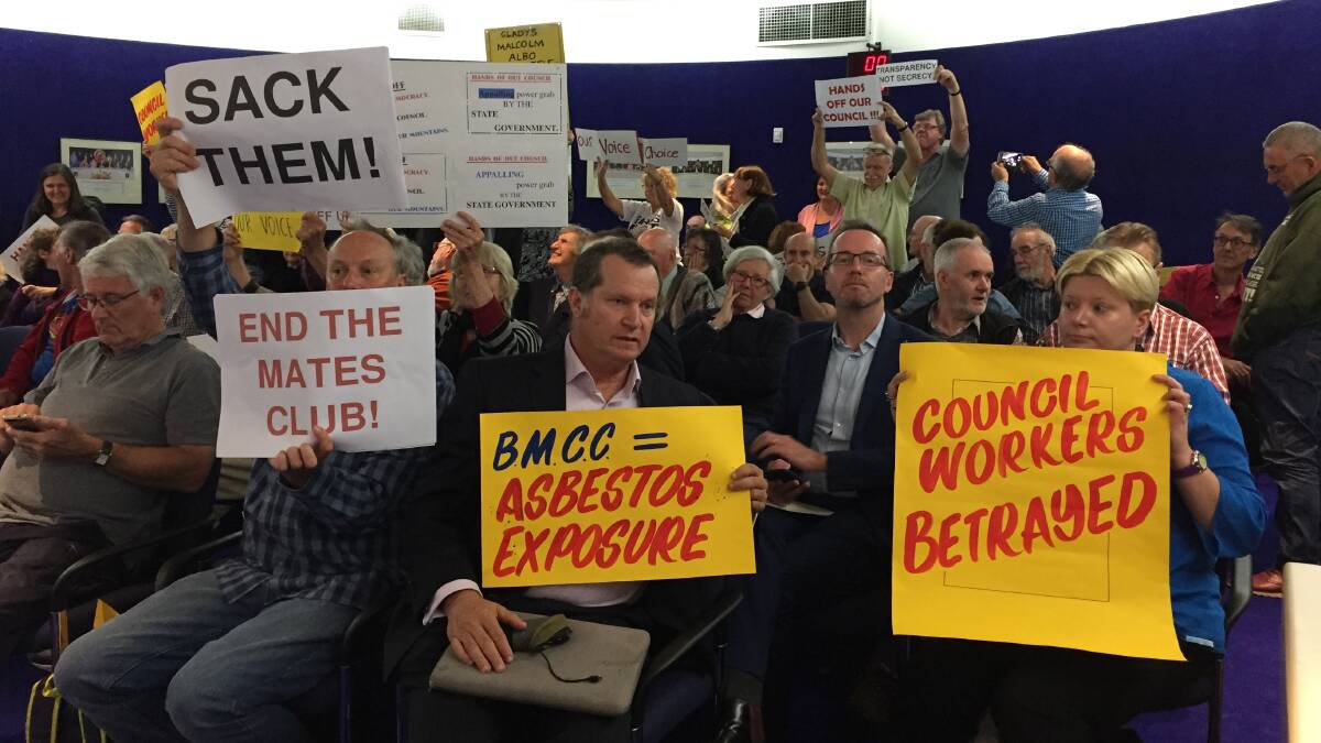 Those against: The public gallery was full at the February 20 extraordinary council meeting and included signs in support of, as well as critical of, Blue Mountains Council.