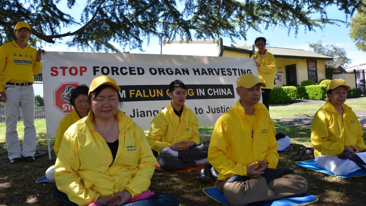 Peaceful protest: A Sydney-based group of Falun Gong practitioners were in Springwood on Friday, raising awareness about forced organ harvesting in China.