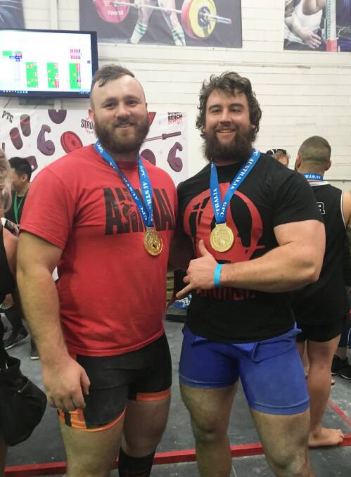 Powerlifters: Clint Taylor and Kieran Brown with their medals after the state titles.