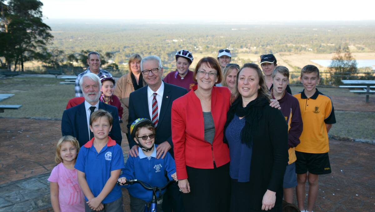 Pathway commitment: Councillor Mick Fell, Senator Doug Cameron and Labor candidate for Macquarie Susan Templeman, with Melinda Pearse and fellow Hawkesbury Heights residents.