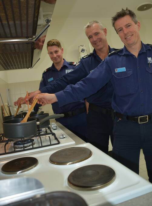 Stay alert: Fire and Rescue NSW firefighters James Forde, Ian Sargeant and Mark Lutherborrow urge Blue Mountains residents to 'keep looking when cooking'.