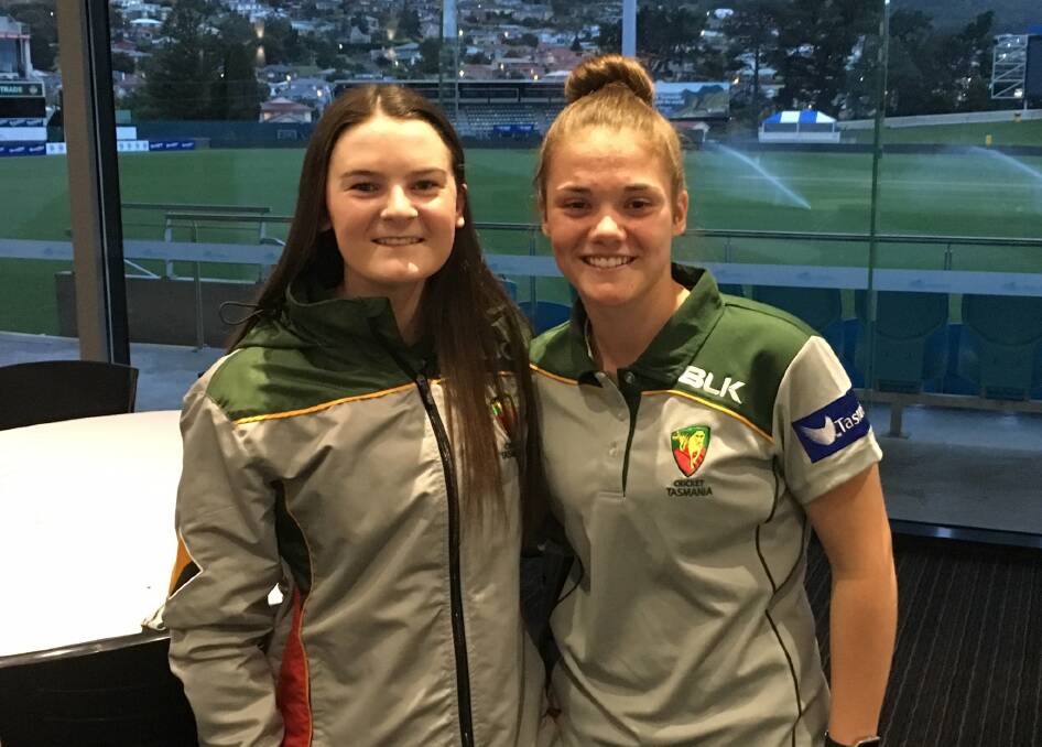 RIVAL MATES: Webb and Emma Manix-Geeves share a moment inside the pavilion at Bellerive Oval. Picture: Cricket Tasmania