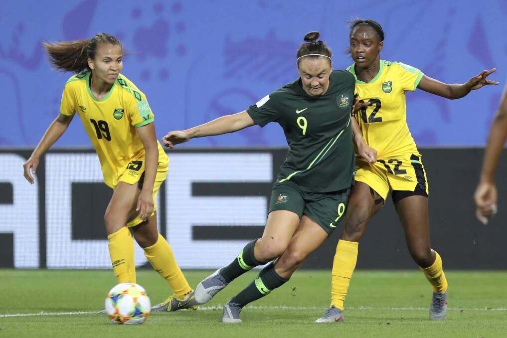 Australia's Caitlin Foord fights for the ball with Jamaica's Sashana Campbell and Toriana Patterson. Picture: AP