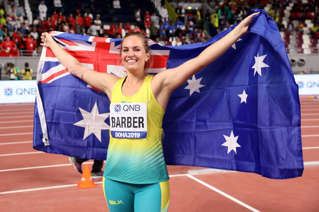 Canberra's Kelsey-Lee Barber celebrates her gold medal triumph at the world championships in Doha. Picture: Getty Images 