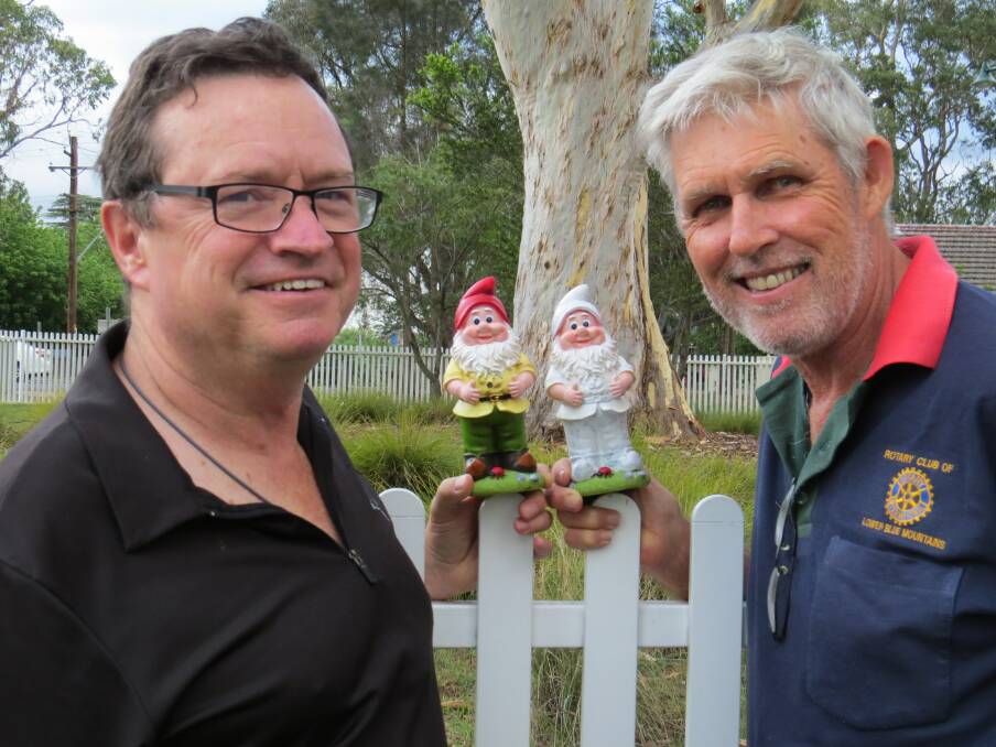 Gnome masters Trevor Lloyd (left) and David Cook with two of the Chinese Gnomes on an acclimatisation ‘tour’ of Glenbrook Park last week. 