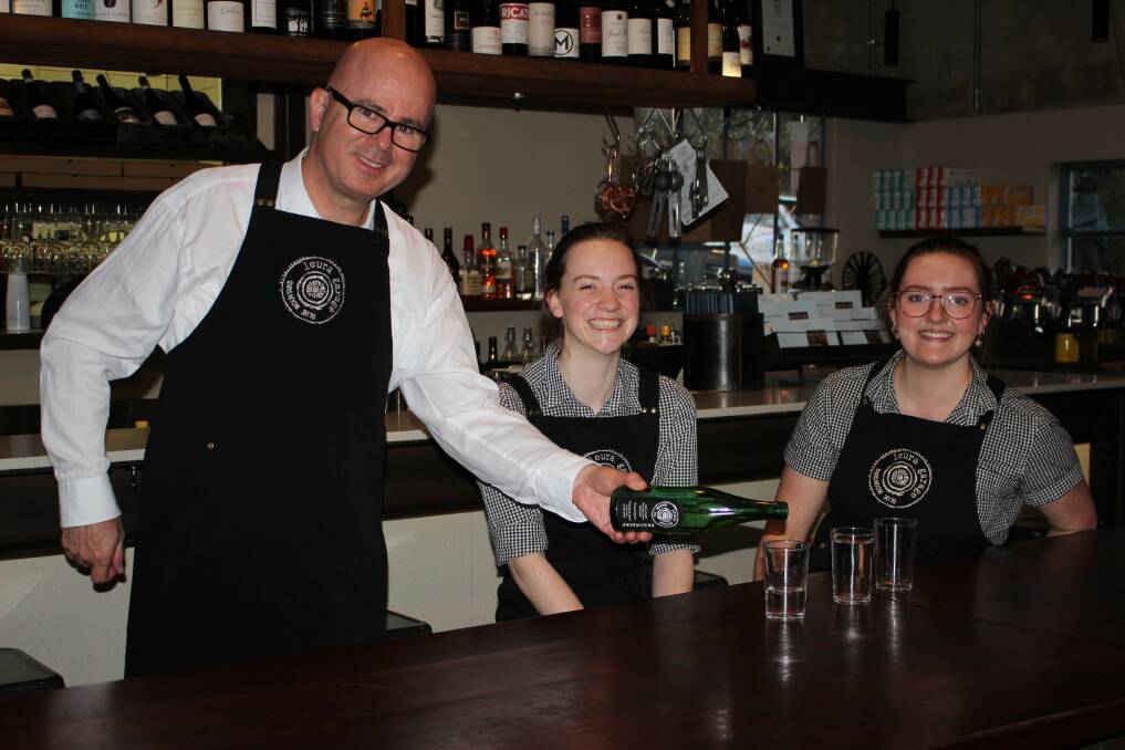 Blue Mountains mayor Mark Greenhill with Caitlin Schultz and Beth Coggins, at Leura Garage Cafe and Restaurant, which is featured in the experience trails.