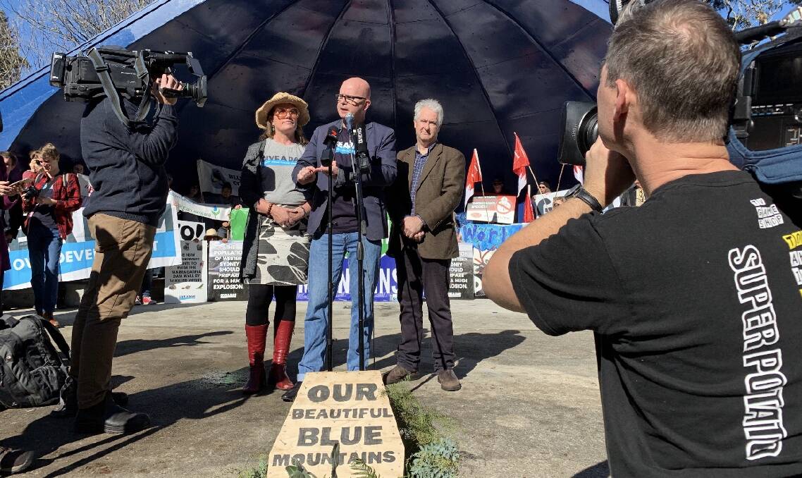 Blue Mountains mayor Mark Greenhill addresses a rally against the Warragamba Dam wall raising in Katoomba on June 9, flanked by Blue Mountains MP Trish Doyle and NSW Labor Upper House MP Adam Searle.