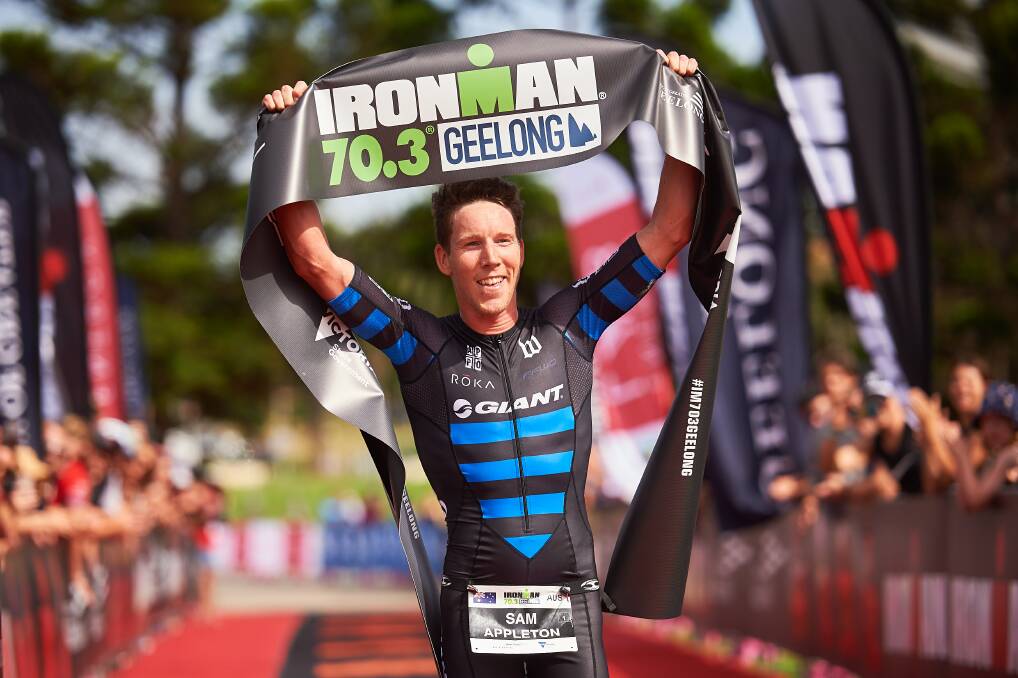 Sam Appleton crosses the finish line as the winner at Ironman 70.3 in Geelong this year.